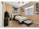 Cozy bedroom showcasing a ceiling fan and window, creating a relaxing and well-lit atmosphere at 7232 Frontier Hills Ave, Las Vegas, NV 89113