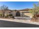 Charming single-story home with a well-maintained desert-landscaped front yard and a two-car garage at 7232 Frontier Hills Ave, Las Vegas, NV 89113