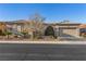 Charming single-story home featuring desert landscaping and a tile roof at 7232 Frontier Hills Ave, Las Vegas, NV 89113