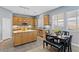 Eat-in kitchen features an island, stainless steel appliances, and neutral countertops at 7232 Frontier Hills Ave, Las Vegas, NV 89113