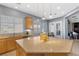 Bright kitchen featuring an island, stainless steel appliances, and neutral countertops at 7232 Frontier Hills Ave, Las Vegas, NV 89113