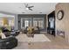 Comfortable living room with a fireplace, plush seating, and lots of natural light at 7232 Frontier Hills Ave, Las Vegas, NV 89113