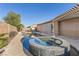 Lush pool and spa area in the private backyard, offering a serene outdoor oasis at 7232 Frontier Hills Ave, Las Vegas, NV 89113