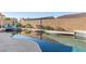 Private pool and landscaped backyard with a privacy wall, perfect for outdoor entertaining at 7232 Frontier Hills Ave, Las Vegas, NV 89113