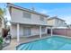 Backyard pool with an awning that shades the patio at 7416 Tuckaway Harbor St, Las Vegas, NV 89139