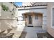 Inviting home entrance with arched porch and stylish front door at 7416 Tuckaway Harbor St, Las Vegas, NV 89139