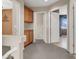 Hallway with built in wooden cabinets and carpeted floors at 7416 Tuckaway Harbor St, Las Vegas, NV 89139