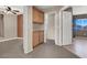 Hallway with built in wooden cabinets and carpeted floors at 7416 Tuckaway Harbor St, Las Vegas, NV 89139