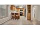 Eat-in kitchen with wood cabinets and modern appliances and room for bar stools at 7416 Tuckaway Harbor St, Las Vegas, NV 89139