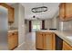 Kitchen area with tile countertops and a view of the outdoor pool and patio at 7416 Tuckaway Harbor St, Las Vegas, NV 89139