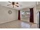 Comfortable living room with tile floors and natural light from the window at 7416 Tuckaway Harbor St, Las Vegas, NV 89139