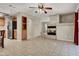 Open living area with tile floors, built in cabinet, and fireplace at 7416 Tuckaway Harbor St, Las Vegas, NV 89139