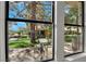 View of the backyard, landscaping, and patio from inside the home at 7803 Canoe Ln, Las Vegas, NV 89145