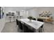 Bright dining area features a marble table, sleek chairs, and stylish decor flowing to the kitchen at 7803 Canoe Ln, Las Vegas, NV 89145