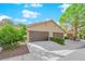 Charming single-story home with two-car garages, manicured landscaping, and welcoming facade at 7803 Canoe Ln, Las Vegas, NV 89145