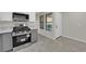 Updated kitchen showcasing stainless steel oven, grey cabinets and modern countertops at 7803 Canoe Ln, Las Vegas, NV 89145