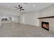 Open floor plan with a modern fireplace, recessed lighting, and tile floors throughout at 7803 Canoe Ln, Las Vegas, NV 89145
