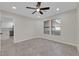 Well-lit living room with recessed lighting, tile flooring and two windows that bring in natural light at 7803 Canoe Ln, Las Vegas, NV 89145