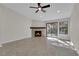 Cozy living room featuring a fireplace and sliding glass doors to outdoor view at 7803 Canoe Ln, Las Vegas, NV 89145