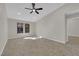 Bright living room featuring large windows, recessed lighting, and tile flooring at 7803 Canoe Ln, Las Vegas, NV 89145