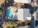 Aerial view of the home featuring a private swimming pool, spa, patio, and an outdoor seating area at 793 Vortex Ave, Henderson, NV 89002