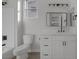 Bathroom featuring a toilet, a vanity with black hardware, framed mirror, and a shower/tub combination at 793 Vortex Ave, Henderson, NV 89002