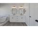 Elegant bathroom featuring a double vanity with marble countertops, modern fixtures, and a freestanding tub at 793 Vortex Ave, Henderson, NV 89002