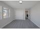 This bedroom features gray walls, gray carpet, and a closet at 793 Vortex Ave, Henderson, NV 89002