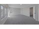 Large bedroom with new carpet and two bright windows; a comfortable space for relaxation at 793 Vortex Ave, Henderson, NV 89002