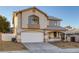 Charming two-story home with a well-maintained lawn, a two-car garage, and a cozy front porch at 793 Vortex Ave, Henderson, NV 89002