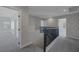 Upstairs hallway with carpeted floor and dark railing overlooking the open first floor at 793 Vortex Ave, Henderson, NV 89002