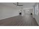 Bright, expansive living space with a modern fireplace, ceiling fan, and access to the kitchen at 793 Vortex Ave, Henderson, NV 89002