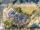 Aerial view of a park featuring a playground, covered seating area, basketball court, and palm tree landscaping at 793 Vortex Ave, Henderson, NV 89002