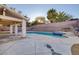 Inviting backyard with pool, spa, covered patio, and well-maintained landscaping, perfect for outdoor entertaining at 793 Vortex Ave, Henderson, NV 89002