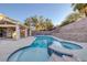 Inviting backyard with pool, spa, covered patio, and well-maintained landscaping, perfect for outdoor entertaining at 793 Vortex Ave, Henderson, NV 89002