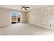 Spacious bedroom with carpet flooring, unique wall design, and a private balcony offering scenic views at 806 Neath Ave, Las Vegas, NV 89178