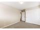 Neutral bedroom with plush carpet, dual closet and an entry to another room at 806 Neath Ave, Las Vegas, NV 89178