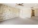 Large bonus room with a unique wall design, ceiling fan, and access to a bathroom at 806 Neath Ave, Las Vegas, NV 89178