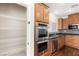 Updated kitchen features stainless steel appliances, and granite countertops at 806 Neath Ave, Las Vegas, NV 89178