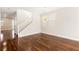 A bright living room features hardwood floors, and a modern hanging light fixture at 806 Neath Ave, Las Vegas, NV 89178