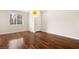 A bright living room features hardwood floors, and a modern hanging light fixture at 806 Neath Ave, Las Vegas, NV 89178