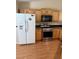 Bright kitchen with stainless steel appliances, wooden cabinets, and plenty of counter space at 807 Airy Hill St, Henderson, NV 89015