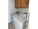 Functional laundry area equipped with a washer, dryer, and storage cabinets at 807 Airy Hill St, Henderson, NV 89015