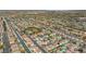 High-altitude aerial view highlighting a vibrant suburban community, green spaces, and well-connected streets at 8100 Artistic Heights Ct, Las Vegas, NV 89143