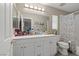 Bathroom showcasing white cabinets and ample storage space, along with a combined shower and tub at 8100 Artistic Heights Ct, Las Vegas, NV 89143