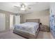 Bedroom showcasing neutral tones, a ceiling fan and direct access to the closet and en-suite bathroom at 8100 Artistic Heights Ct, Las Vegas, NV 89143