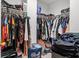 Walk-in closet with an extensive hanging clothing and storage system at 8100 Artistic Heights Ct, Las Vegas, NV 89143