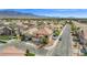 Charming two-story home with a well-manicured lawn, desert landscaping, and a two car garage at 8100 Artistic Heights Ct, Las Vegas, NV 89143