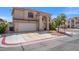 Well-maintained two-story home featuring a two-car garage, desert landscaping, and a traditional facade at 8100 Artistic Heights Ct, Las Vegas, NV 89143