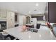 Spacious kitchen boasts a large island, modern appliances, and plenty of cabinet space, ideal for cooking and entertaining at 8100 Artistic Heights Ct, Las Vegas, NV 89143